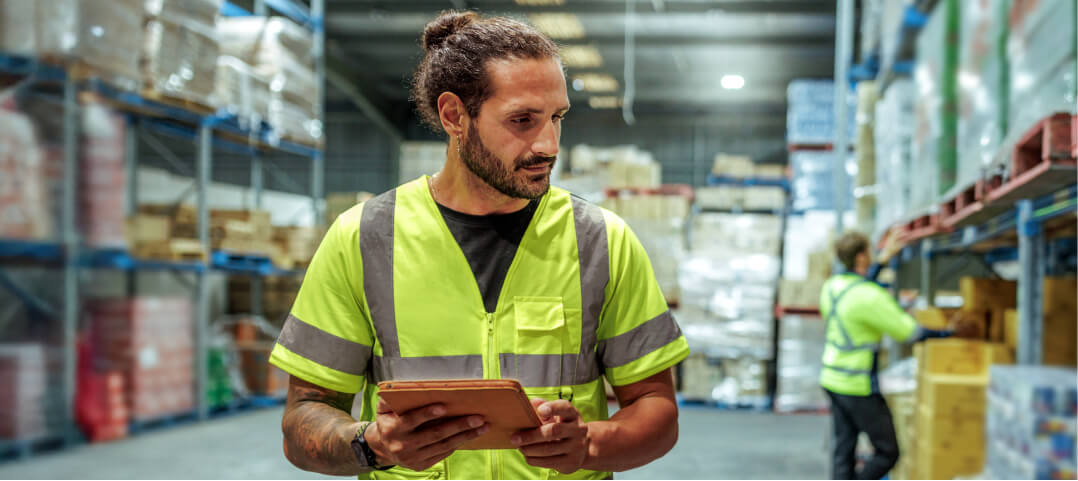 A photo of a man in a warehouse setting