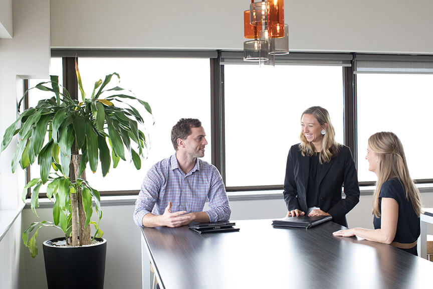 Group of people talking around a table